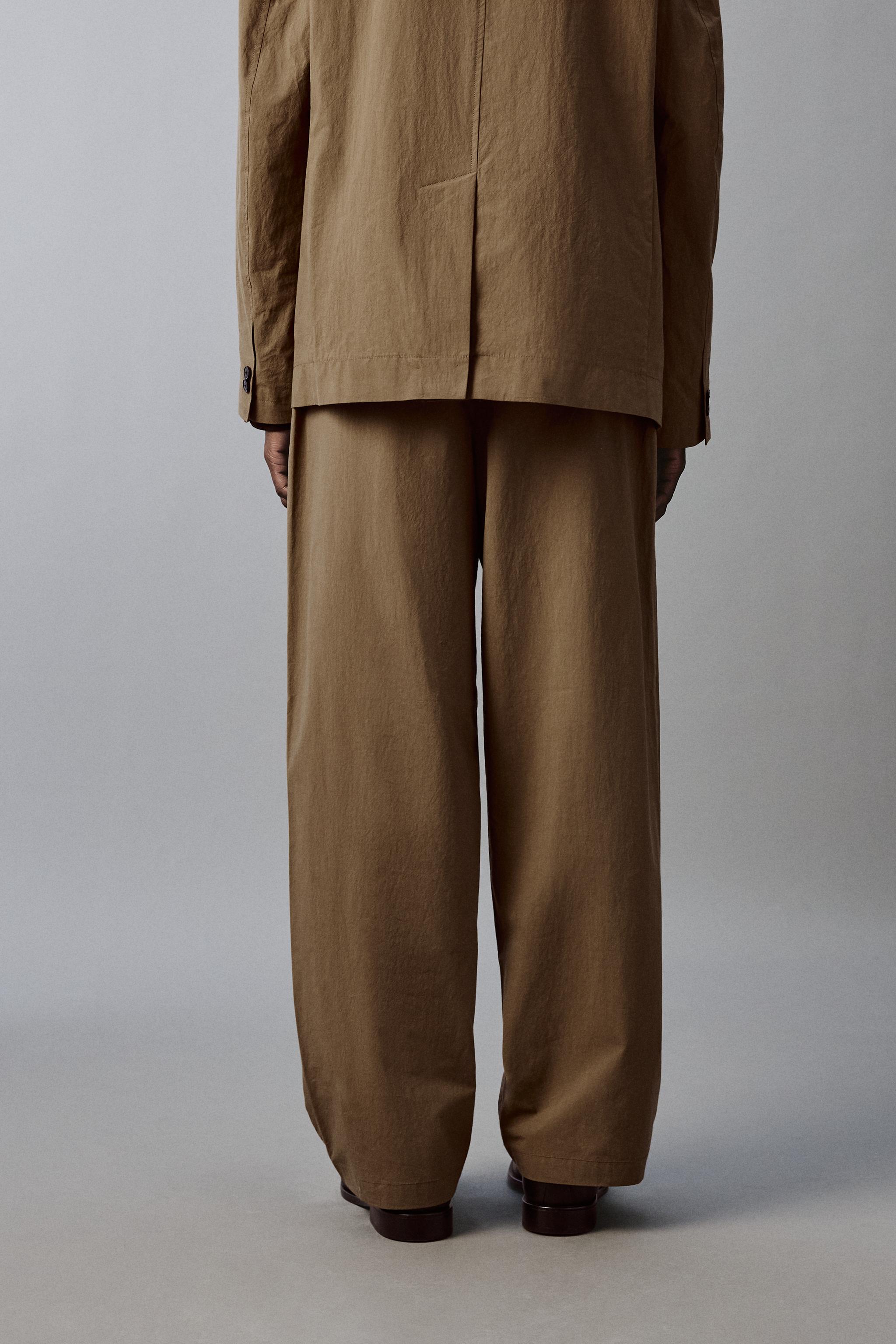 TECHNICAL WIDE FIT SUIT PANTS